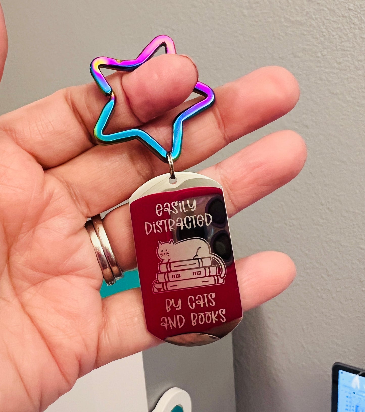 Easily distracted by cats and books | Key Chain