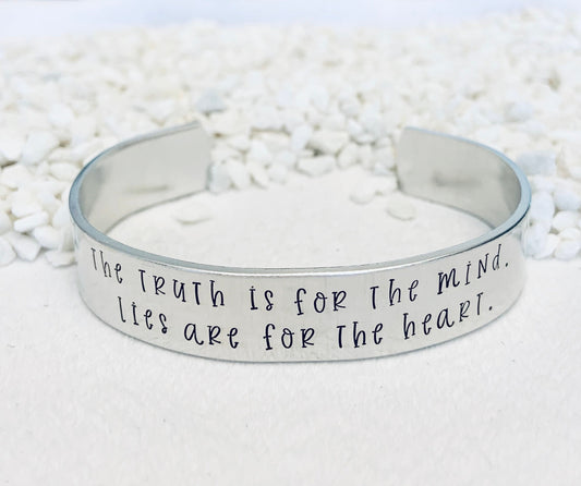 The truth is for the mind. Lies are for the heart. (Tarryn Fisher) - Cuff Bracelet
